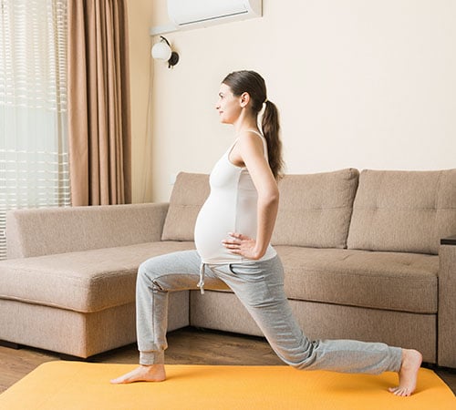 Pregnant couple doing yoga